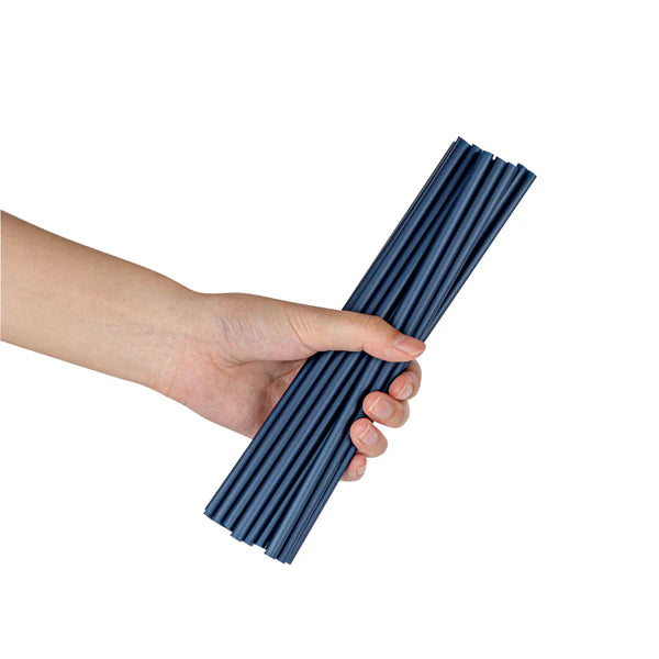 Hand holding a bundle of Ecoz black compostable straws.