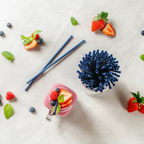 Compostable Black straws in a container with a pink drink.