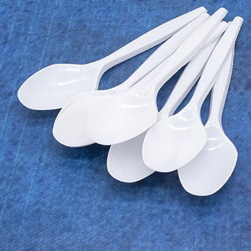 A collection of Ecoz white disposable dinner spoons.