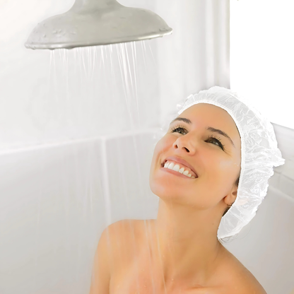 Woman wearing a Ecoz biodegradable shower cap under a shower