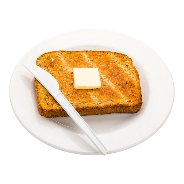 Toast with a pat of butter on a white plate with a Ecoz compostable knife. 
